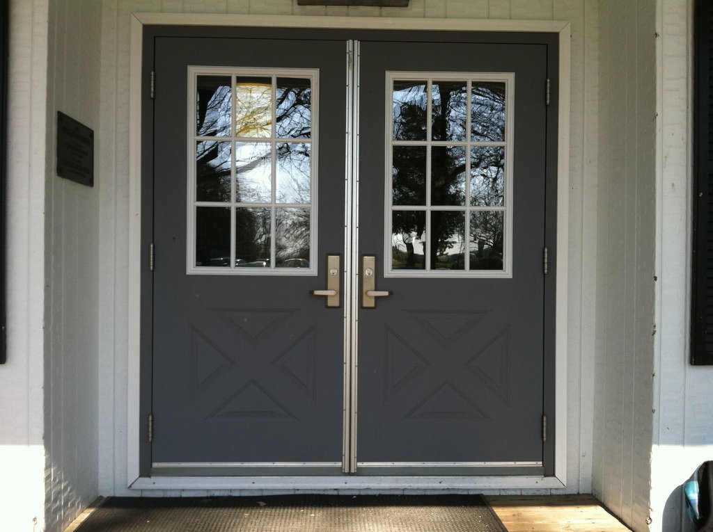 the front door of a house with two double doors