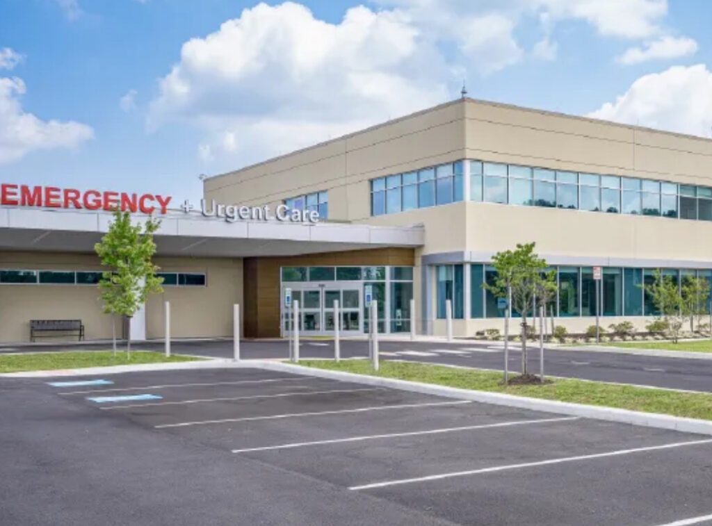 an empty parking lot in front of a hospital